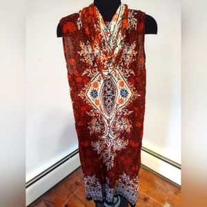 Uniti Casual clothiers NYC small brand cultural print hooded vest orange/black